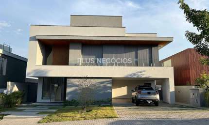 Casa nova no Alphaville 2 com 5 suítes, piscina com borda infinita e vista incrível — estuda até 10