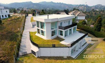 Casa com 5 dormitórios à venda, 420 m² por R$ 4.500.000,00 - Jardim Europa - Campos do Jordão/SP