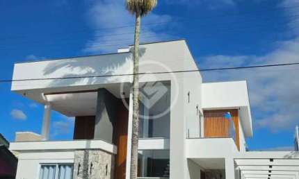 Casa frente ao mar na Praia da Daniela. Com 5 dormitorios, 6 banheiros, 3 vagas de garagem, piscina e muito mais! codigo: 129672