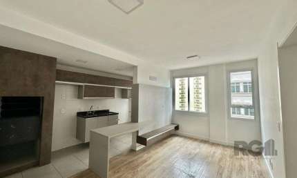 Apartamento para alugar no Bairro Menino Deus com 1 dormitório semi-mobiliado.