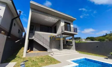 Casa à venda em Atibaia com 3 suítes, piscina aquecida e cozinha com ilha – Sofisticação e conforto