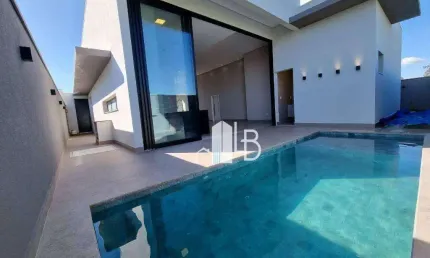 Casa alto padrão no condomínio Arts com três suítes, escritório com lavabo e área gourmet completa.