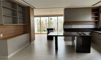 Casa no Condomínio Alphaville I com quatro quartos, três suítes e área gourmet completa.