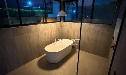 Casa no condomínio Jardim Gênova com quatro suítes, escritório com lavabo e área gourmet completa.