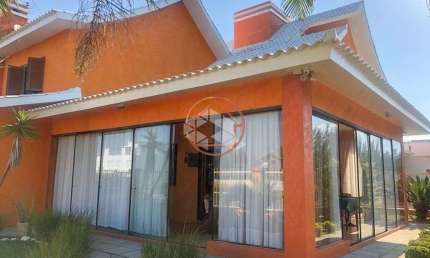 Casa em condomínio fechado com 5 quartos à venda na Das Orquídeas, 124, Capão Novo, Capão da Canoa por R$ 1.804.000