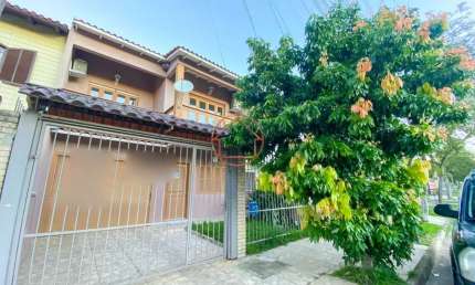 Casa com 3 quartos à venda na Rua Anhumas, 42, Jardim Algarve, Alvorada por R$ 498.000
