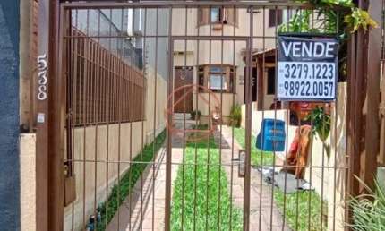 Casa com 2 quartos à venda na Rua Professora Ziláh Totta, 538, Jardim Leopoldina, Porto Alegre por R$ 450.000