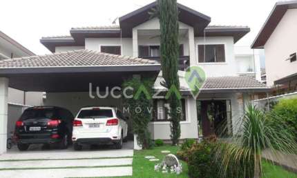Casa de luxo em condomínio com 4 suítes no Jardim Altos de Santana II, Jacareí-SP: 406m², 3 salas e 2 vagas de garagem.