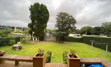 Casa em condomínio fechado com 3 quartos à venda na Rodovia Haroldo Soares Glavan, 5, Cacupé, Florianópolis, 200 m2 por R$ 2.300.000