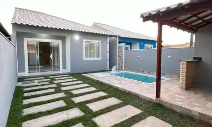 Casa com piscina e área gourmet em condomínio - unamar