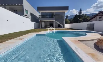 Casa em condomínio fechado com 4 quartos à venda em Horto Florestal, Ubatuba  por R$ 1.390.000