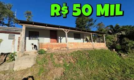 [840] CASA EM TAQUARA COM 3 DORMITÓRIOS, 2 BANHEIROS, POÇO ARTESIANO, AO LADO DA RS 020