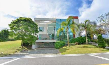 casa de 615 m²  a venda no alphavile graciosa, com 5 suites, 7 bh, 3 salas, 4 gar.,cozinha americana completa,  piscina aquecida, edicula, escritorio