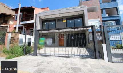Casa com 3 quartos à venda na Rua Buarque de Macedo, 931, São Geraldo, Porto Alegre