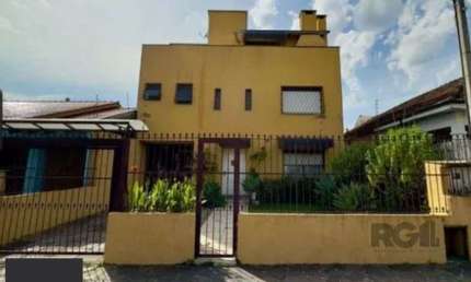 Casa com 3 quartos à venda na Rua Monteiro Lobato, 303, Partenon, Porto Alegre