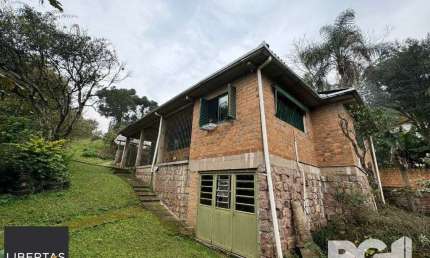 Casa com 3 quartos à venda na Rua dos Canudos, 358, Cascata, Porto Alegre