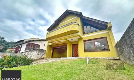 Casa com 3 quartos à venda na Rua Costa Lima, 479, Nonoai, Porto Alegre