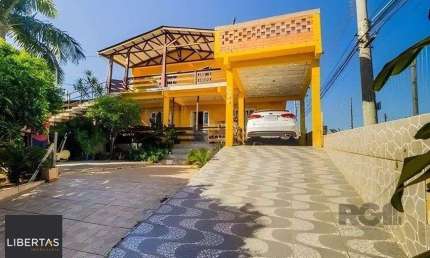 casa de 4 dormitórios,  no bairro Lomba do Pinheiro