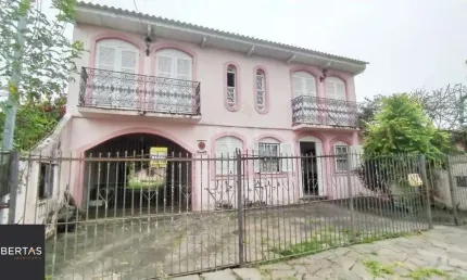 Casa com 3 quartos à venda na Rua Jacipuia, 332, Guarujá, Porto Alegre