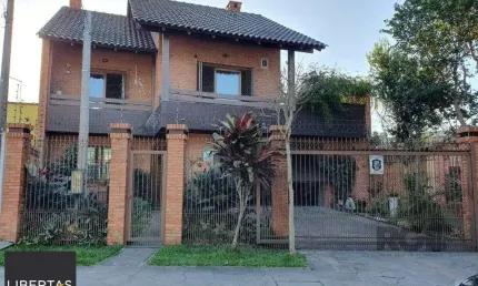 Casa com 3 quartos à venda na Rua Conselheiro Davila, 632, Jardim Floresta, Porto Alegre