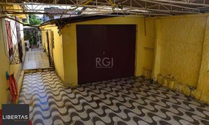 Casa com 5 quartos à venda na Rua Primeiro de Maio, 397, Partenon, Porto Alegre