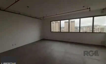 Excelente sala comercial no menino deus, com uma vaga de garagem.