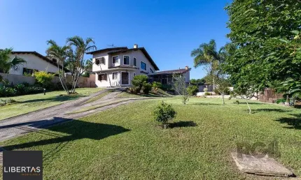 Casa com 3 quartos à venda na Rua Flor de Pessegueiro, 105, Vila Nova, Porto Alegre