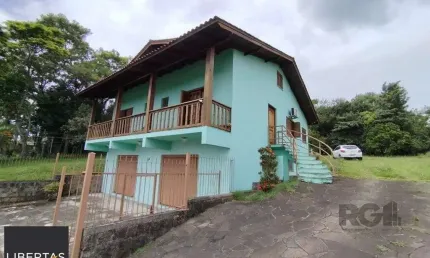 Casa com 3 quartos à venda na Avenida Santo Dias da Silva, 924, Lomba do Pinheiro, Porto Alegre
