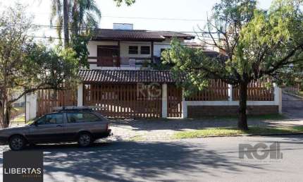 Casa com 4 quartos à venda na Rua Upamaroti, 794, Cristal, Porto Alegre