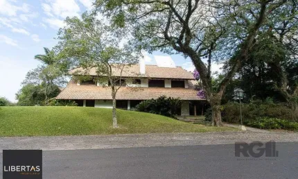 Casa em condomínio fechado com 6 quartos à venda na Avenida da Cavalhada, 5205, Cavalhada, Porto Alegre