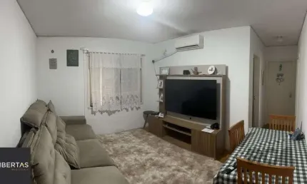 Apartamento de 2 dormitórios, living, cozinha, área de serviço e banheiro social.