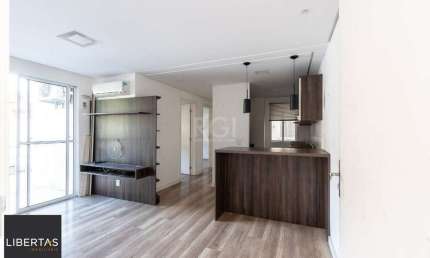 Apartamento 2 dormitórios , sala com dois ambientes , cozinha americana sacada com churrasqueira 1 vaga