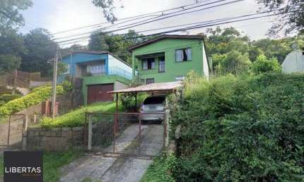 Casa 280m² - 5 dormitórios, 4 banheiros, 2 vagas no bairro Cascata