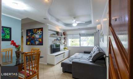 Apartamento de 2 quartos, living, cozinha planejada, área de serviço e 1 vaga.
