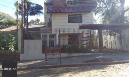 Casa em condomínio fechado com 4 quartos à venda na Rua Upamaroti, 1129, Cristal, Porto Alegre