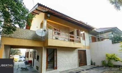 Casa em Porto Alegre, no bairro Cavalhada, com 5 dormitório(s), e 5 banheiros, à venda.