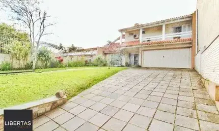 Casa em Porto Alegre, no bairro Jardim Isabel, com 4 dormitório(s), e 4 banheiros, à venda.