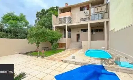 Casa com 3 quartos à venda na Rua Alcebíades Antônio dos Santos, 379, Nonoai, Porto Alegre