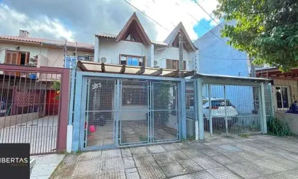 Casa com 2 quartos à venda na Rua Itacyr Rossi, 233, Guarujá, Porto Alegre