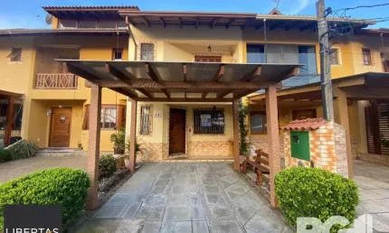 Casa com 3 quartos à venda na Avenida Edgar Pires de Castro, 1286, Hípica, Porto Alegre