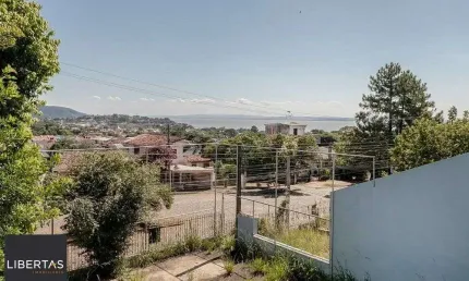 Casa com 3 quartos à venda na Avenida Leonardo Carlucci, 140, Espírito Santo, Porto Alegre