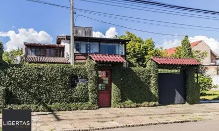Casa com 3 quartos à venda na Avenida Guarujá, 140, Guarujá, Porto Alegre