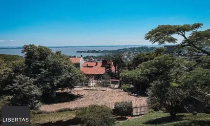Casa bairro sétimo céu, 463m² privativos, vista privilegiada do rio guaíba em terreno de 1.423m².