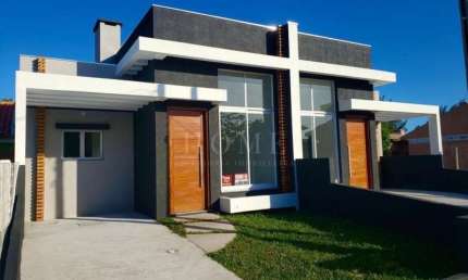 CASA COM 2 DORMITORIOS, SENDO 1 SUITE BEM LOCALIZADO!
