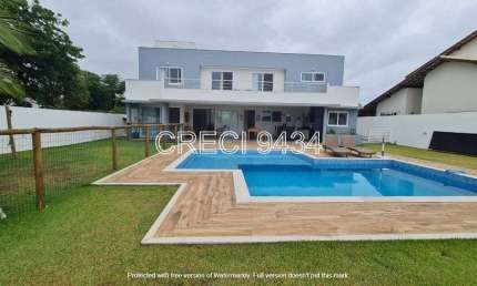 Casa de condomínio para venda possui 410 metros quadrados com 4 quartos