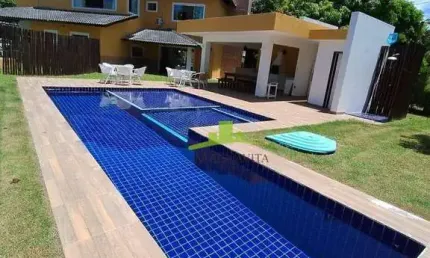 Casa de Luxo em Busca Vida, 425m², 5 suítes, piscina, área gourmet e energia solar, 6 vagas. Condomínio exclusivo no litoral norte, Camaçari