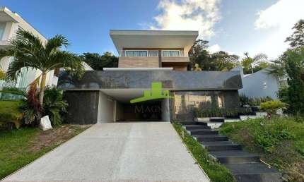 Casa de luxo à venda no Alphaville 1 Salvador | 4 suítes com varanda | Gabinete | Espaço gourmet com piscina e prainha | Reformada | R$ 3.900.000