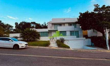 Casa à venda em Alphaville Salvador, 5 quartos, 4 suítes, master com closet, espaço gourmet climatizado, terreno 1.400m². Localização Exclusiva!