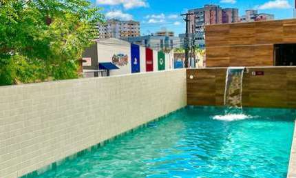 Apartamento novo com 2 quartos a poucos passos da praia 