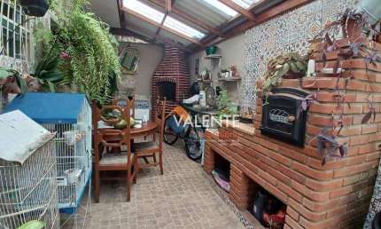 Casa com 3 dormitórios à venda, 135 m² por R$ 600.000,00 - Maracanã - Praia Grande/SP
